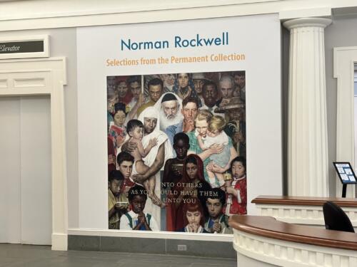 Vinyl lettering and mural of Norman Rockwell painting announcing museum's exhibition of selected works. Mural installed in lobby entrance