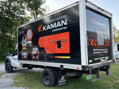 Partial box truck wrap with spot graphics and lettering