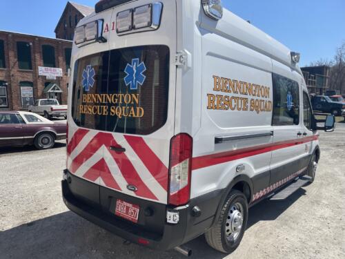 Emergency vehicle spot graphics and lettering with reflective chevron and Battenburg pattern