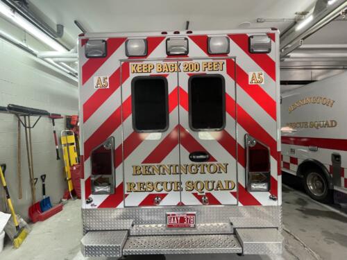 Rescue vehicle graphics with large chevron pattern. Partial wrap with spot decals