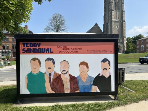 Display at a bus stop shelter featuring a custom sized banner.