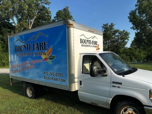 Partial box truck wrap with spot graphics and lettering