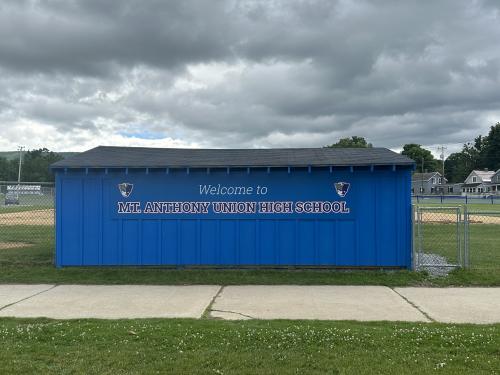 Athletic field sign with school pride.