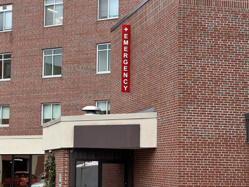 Vinyl covered acrylic sign identifying emergency room.